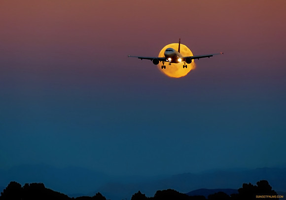 Landing Plane Over Rising Moon